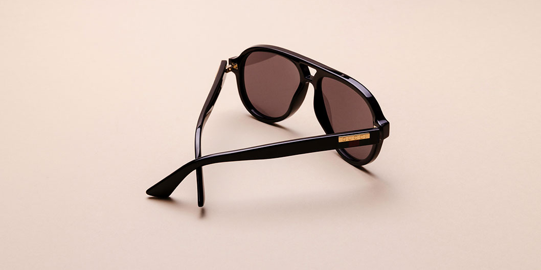 Shop black aviator sunglasses from Gucci